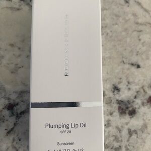 Rodan + Fields Lip Oil with Silver Detail